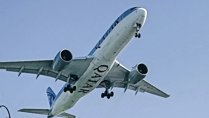 Airplane flying against a clear blue sky